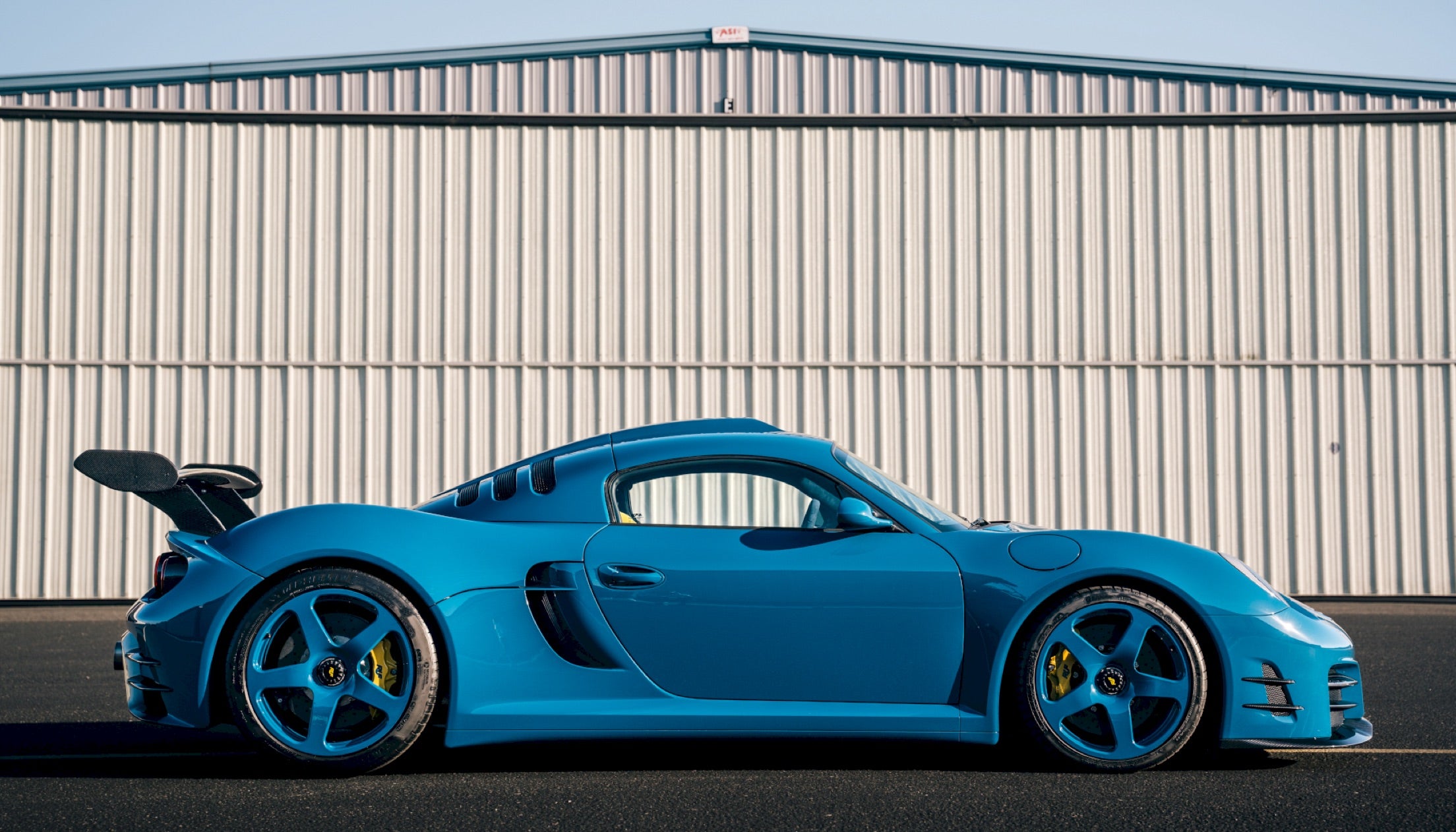 <strong>WAY OF THE RUF</strong><br/><span>Several different models, including a blue CTR3 Evo and green SCR, amid scenes from inside the factory in Pfaffenhausen, Germany</span> <br/><span class="caption-sub">PHOTO CREDIT: Ruf Automobile and Aloisa Ruf</span>